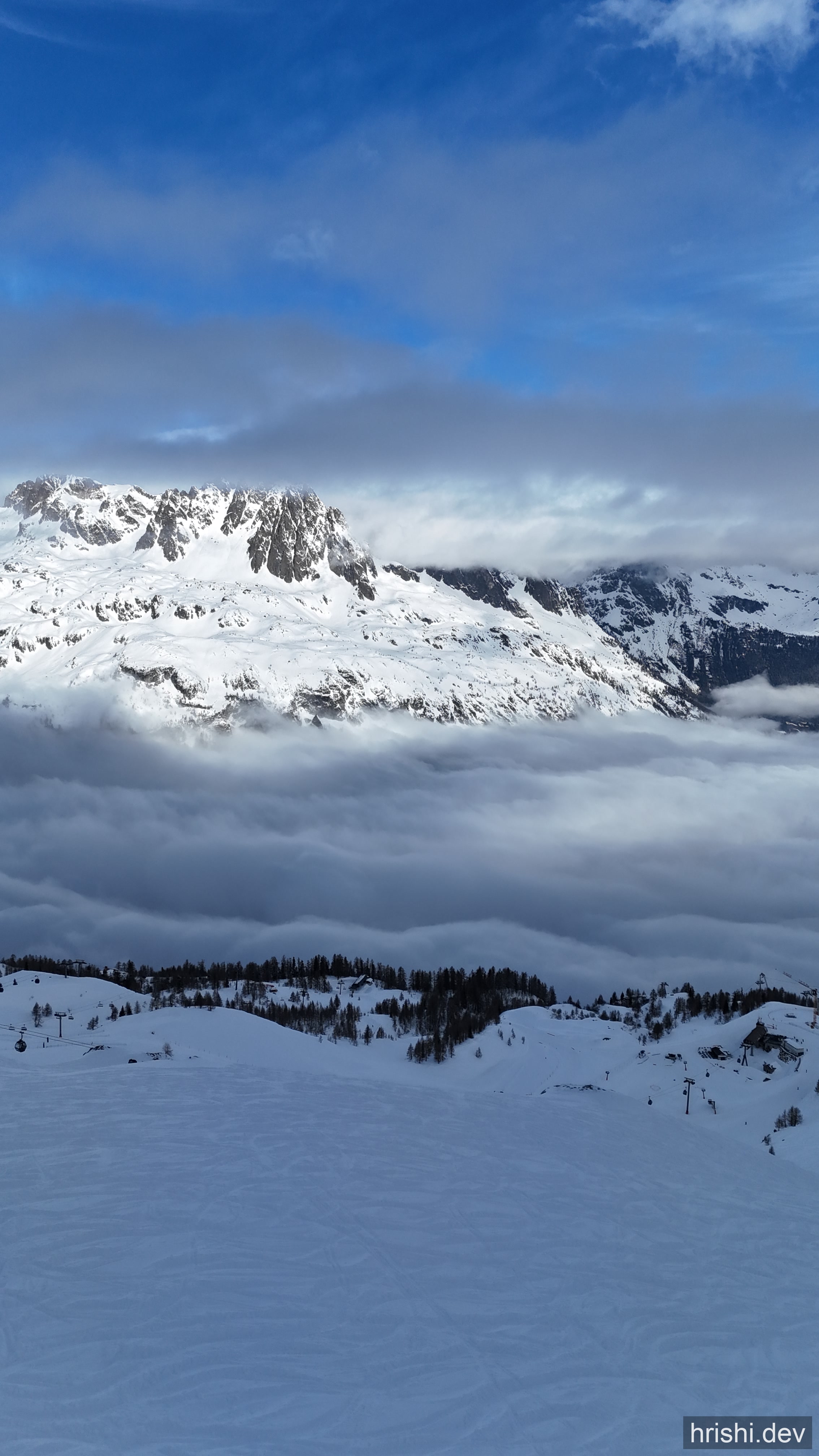 A view of snow-capped mountains and ski slopes from a piste in Morzine, France